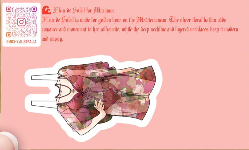 Pink card with a floral dress design and text on a wooden surface